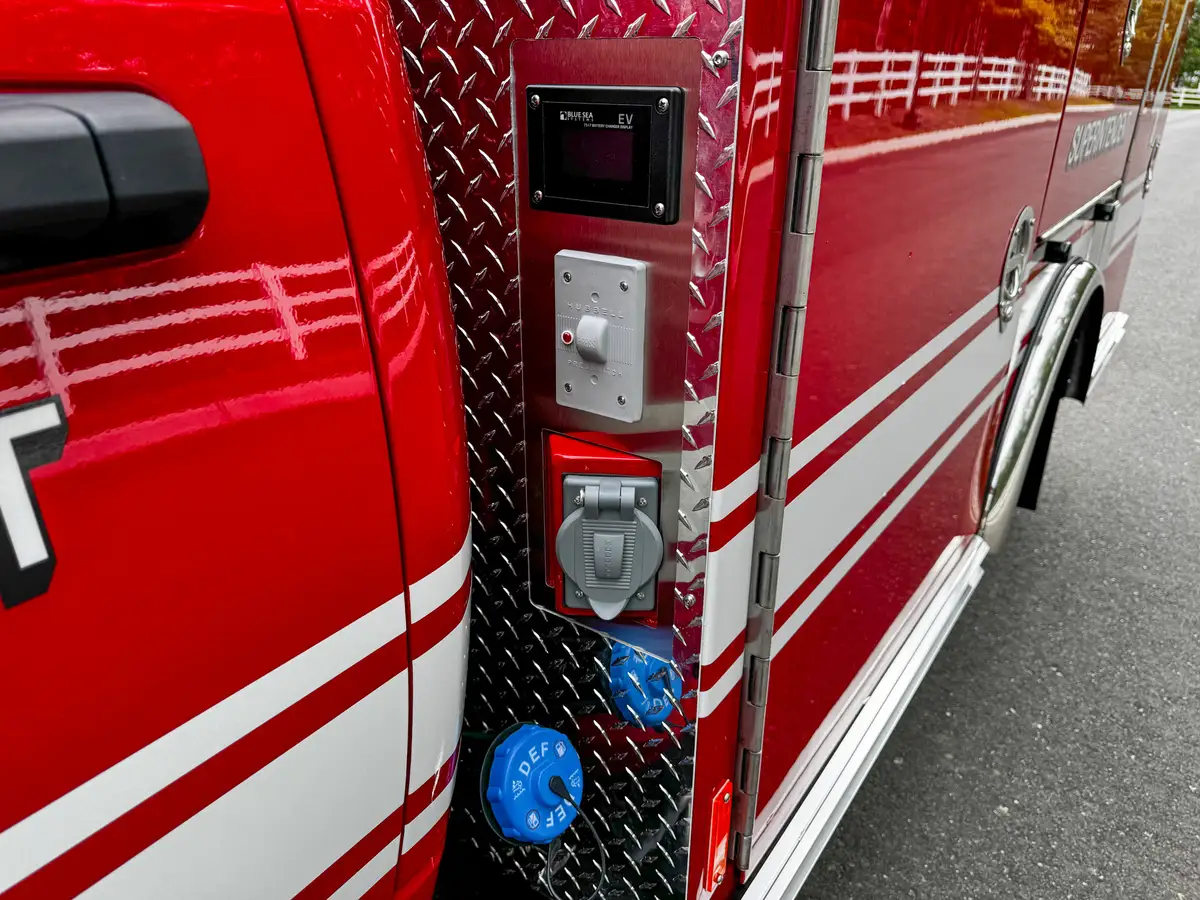 Vertical side panel with connectors and controls near cab.