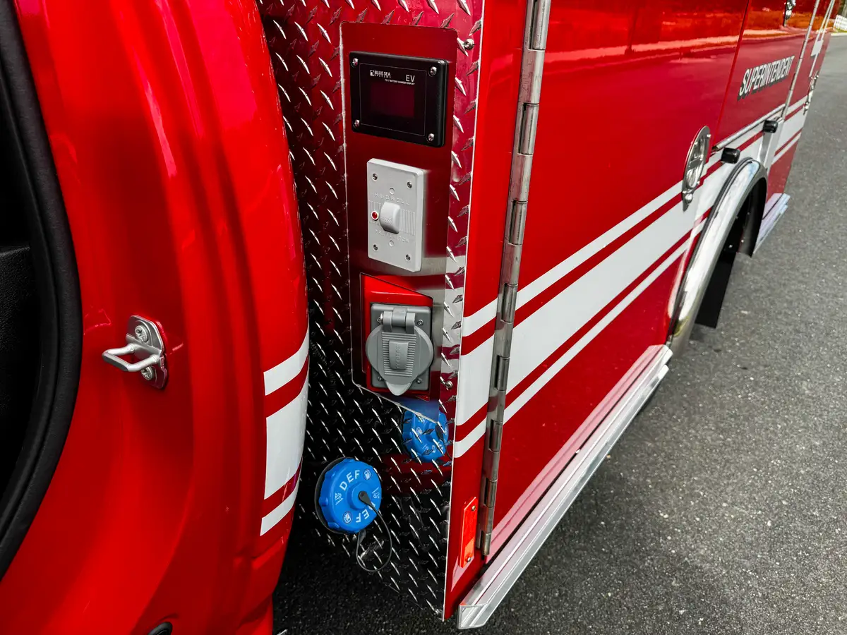 Close-up of side control panel with multiple blue ports.