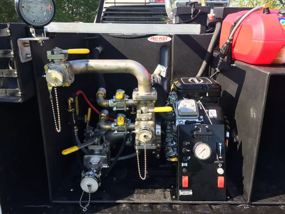 Exterior view of small fire truck showing cab, body compartments, and wheel/tire area.