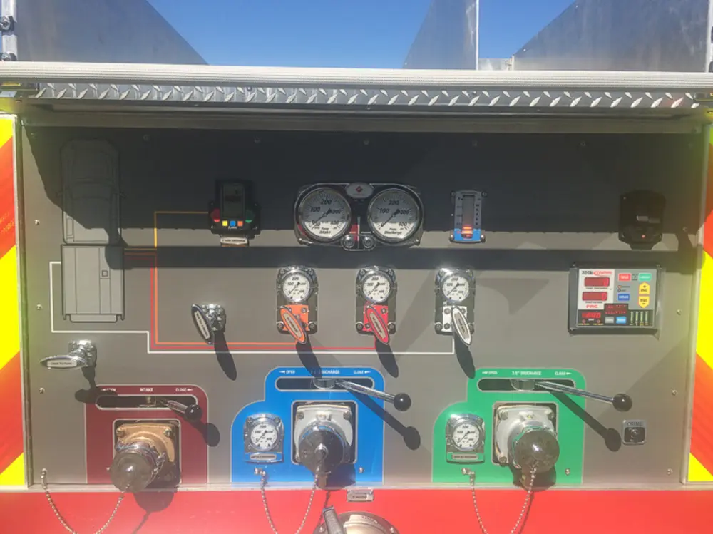 Exterior view of small fire truck showing cab, body compartments, and wheel/tire area.