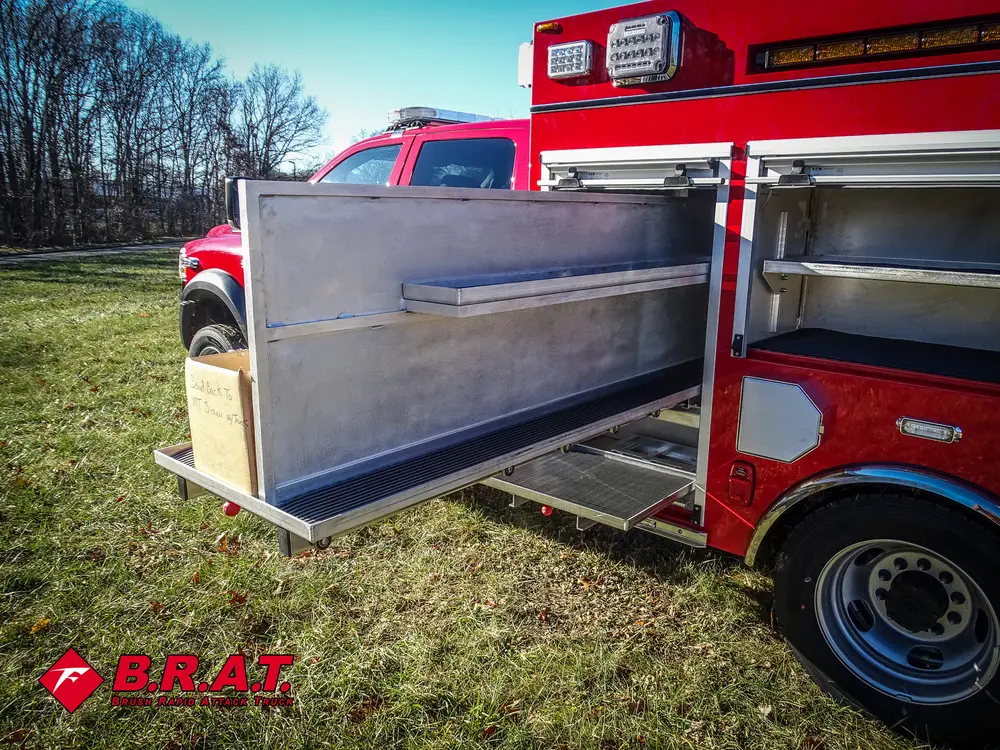 Open side bay with long fold-out shelf panel extended outward.