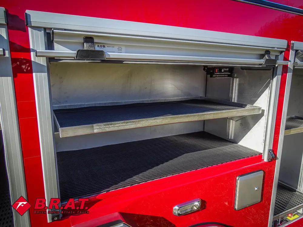 Open side compartment with two long shelves and empty storage space.