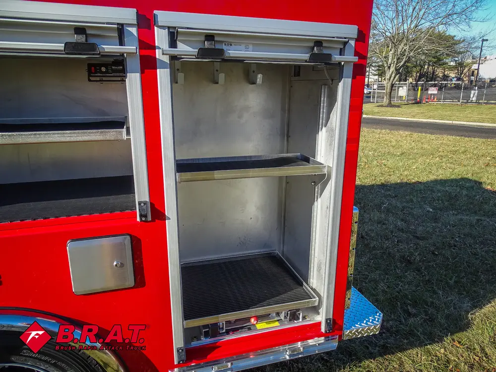 Narrow vertical side compartment with fixed shelf and clean interior.