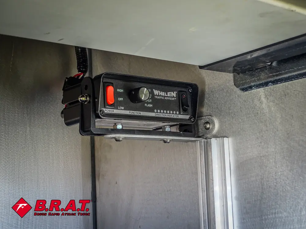 Compartment interior close-up with mounted radio/control unit.