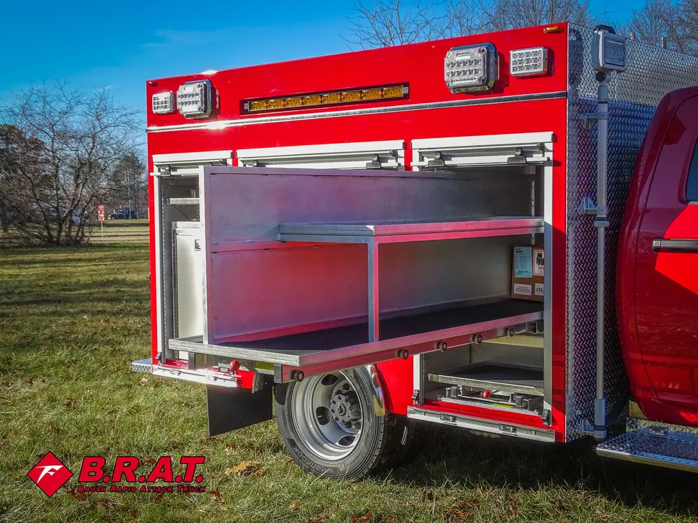 Long slide-out shelf extended from rear side compartment.