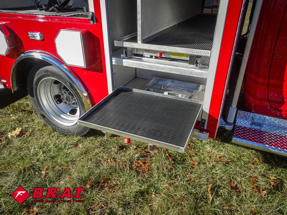 Lower side compartment open with fold-down tray door.