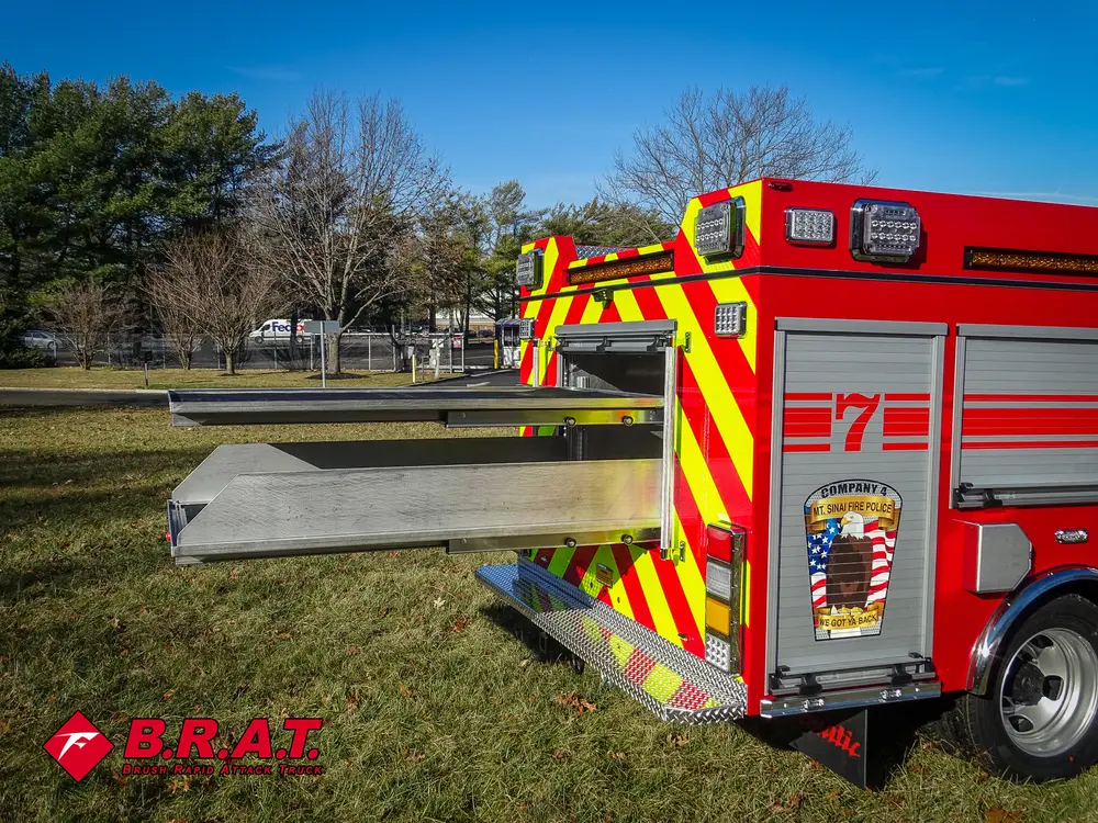 Rear-left three-quarter view with rear slide-out tray extended.