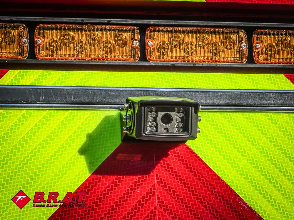 Rear message board close-up with camera/light module below.