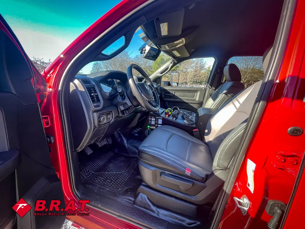 Driver-side interior view with dashboard, steering wheel, and center controls.