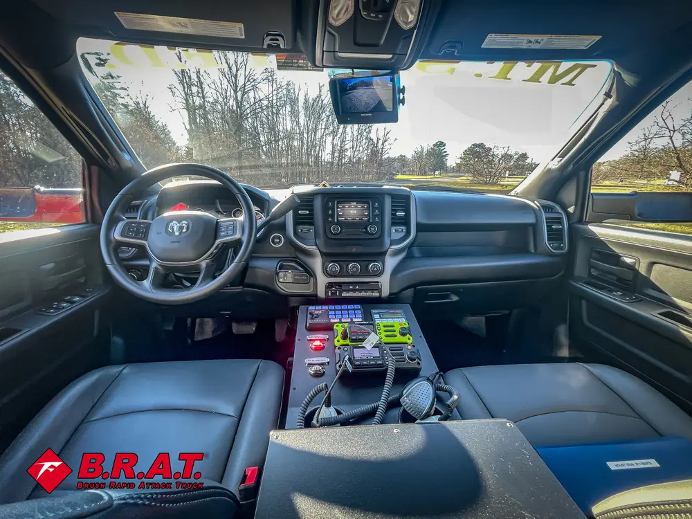 Rear center console with mounted radio microphone and controls.