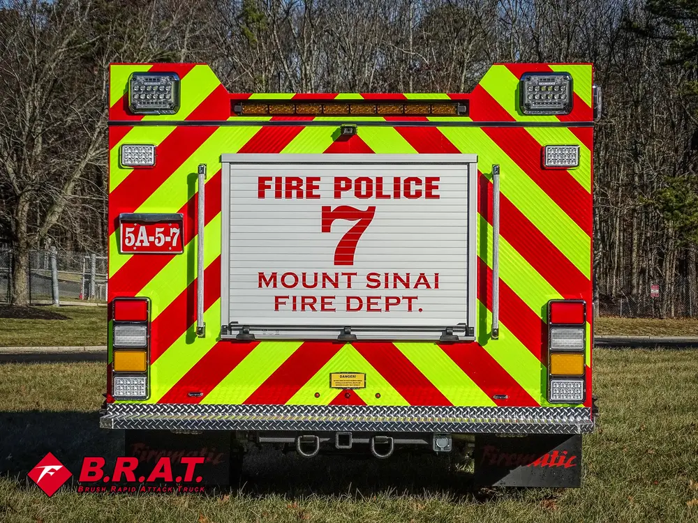 Straight rear view with Fire Police 7 signage and chevron striping.