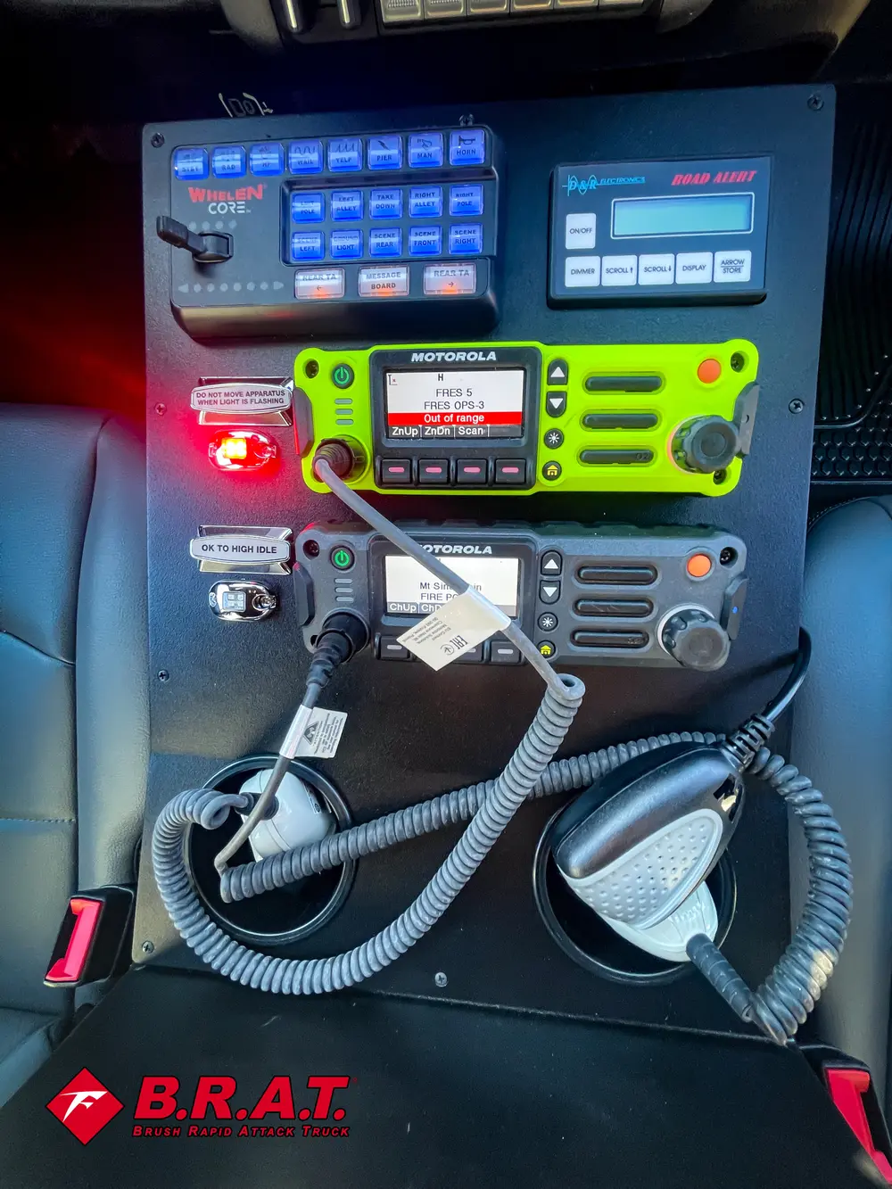 Radio/control console close-up with illuminated indicators.