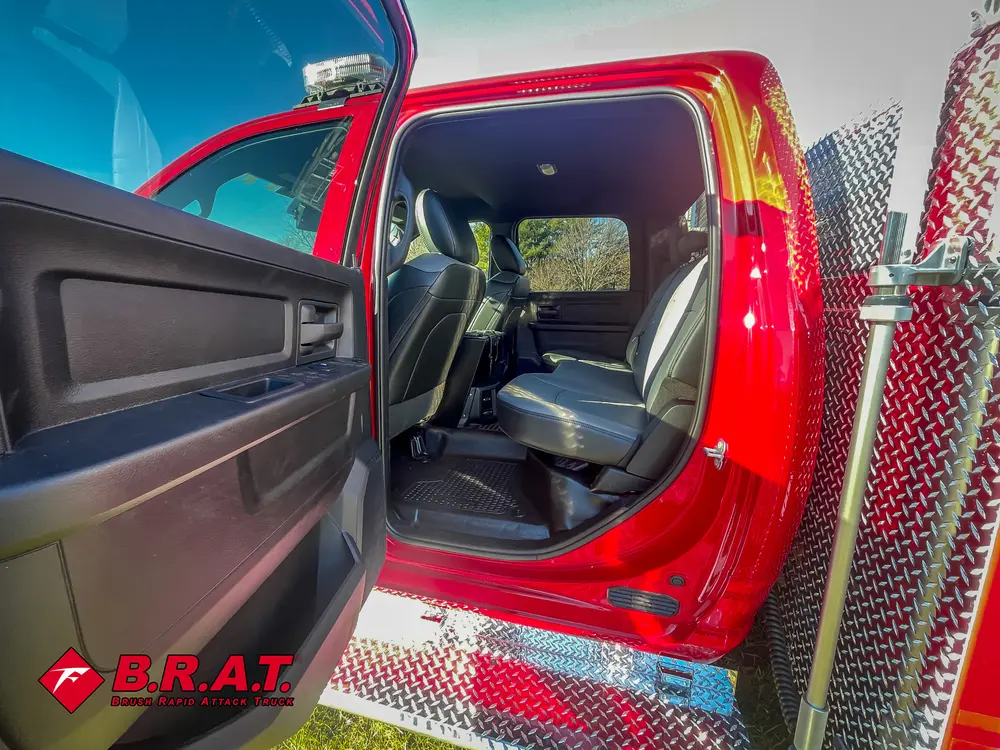 Open rear passenger door view showing rear seating area.