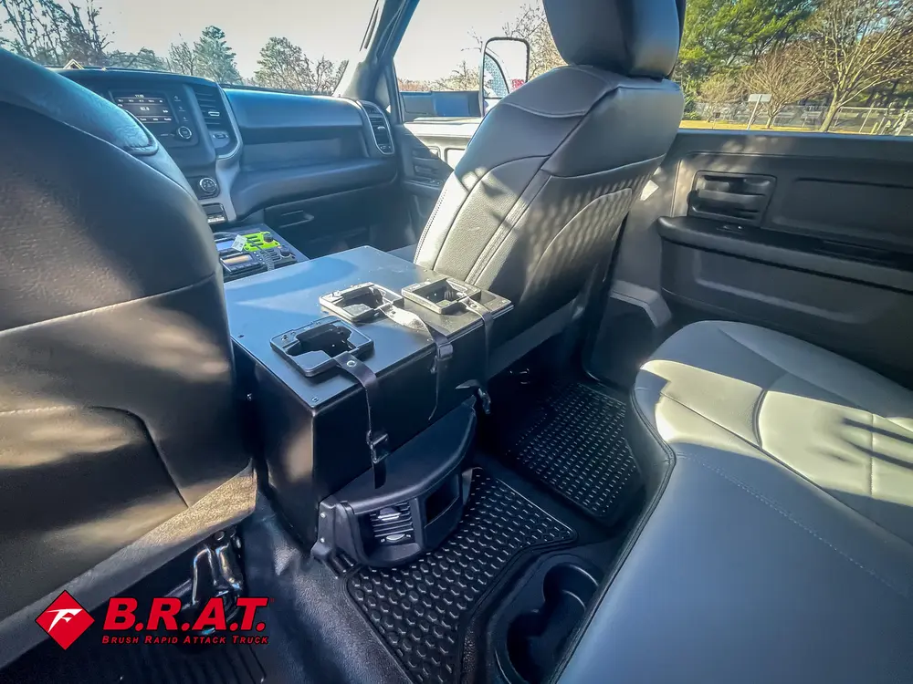 Rear floor and center console area behind front seats.
