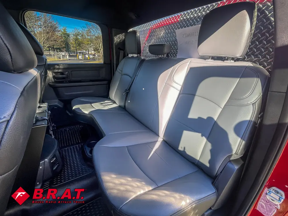 Rear bench seat view with open door and clean upholstery.