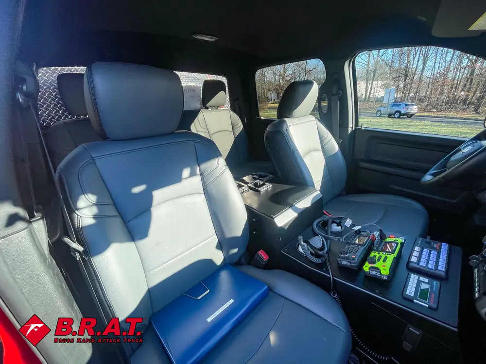 Front cabin from rear perspective with center console controls visible.