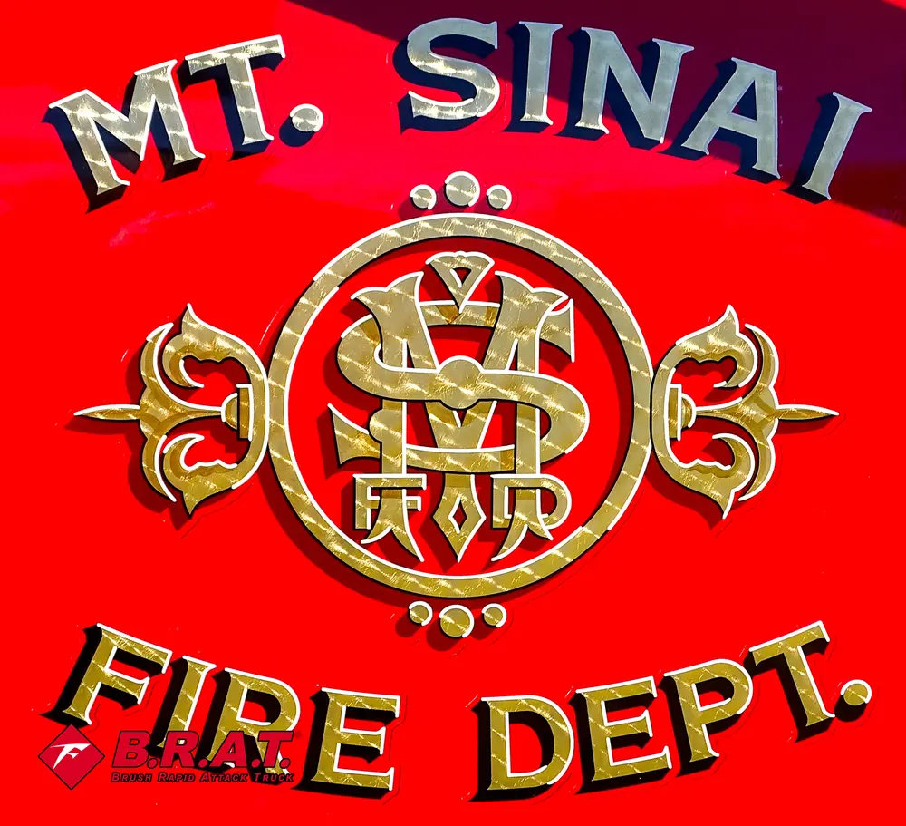 Door emblem close-up with Mount Sinai Fire Department crest.