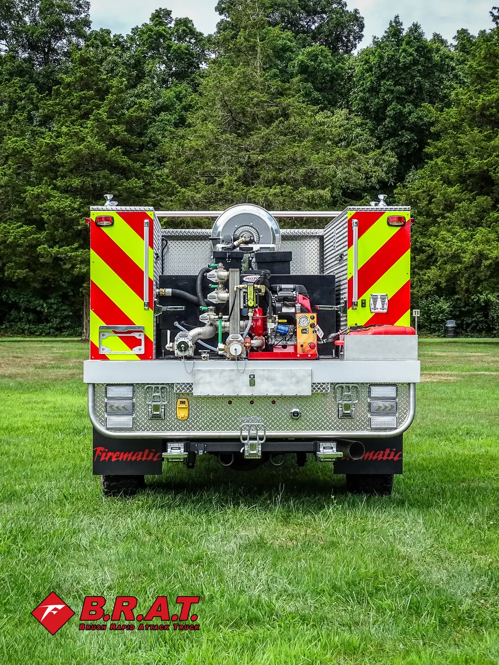 Exterior view of small fire truck showing cab, body compartments, and wheel/tire area.