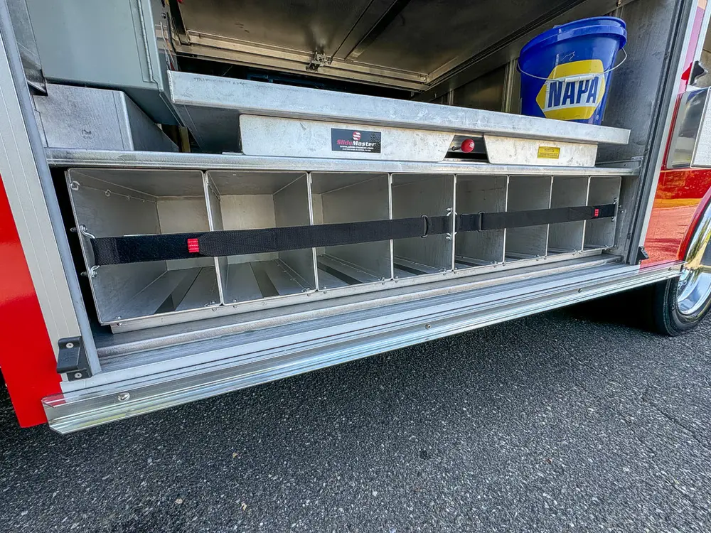 Open side bay with multiple shelves and empty storage levels.