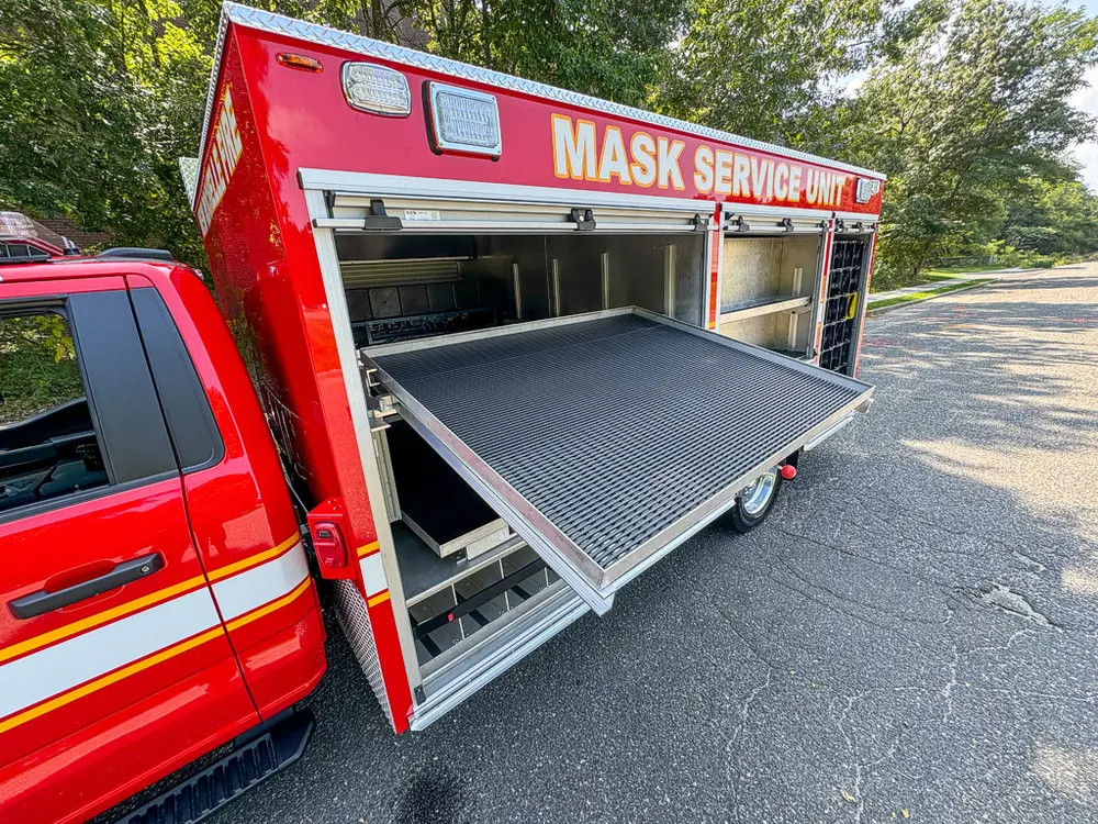 Large side slide-out tray extended from compartment.