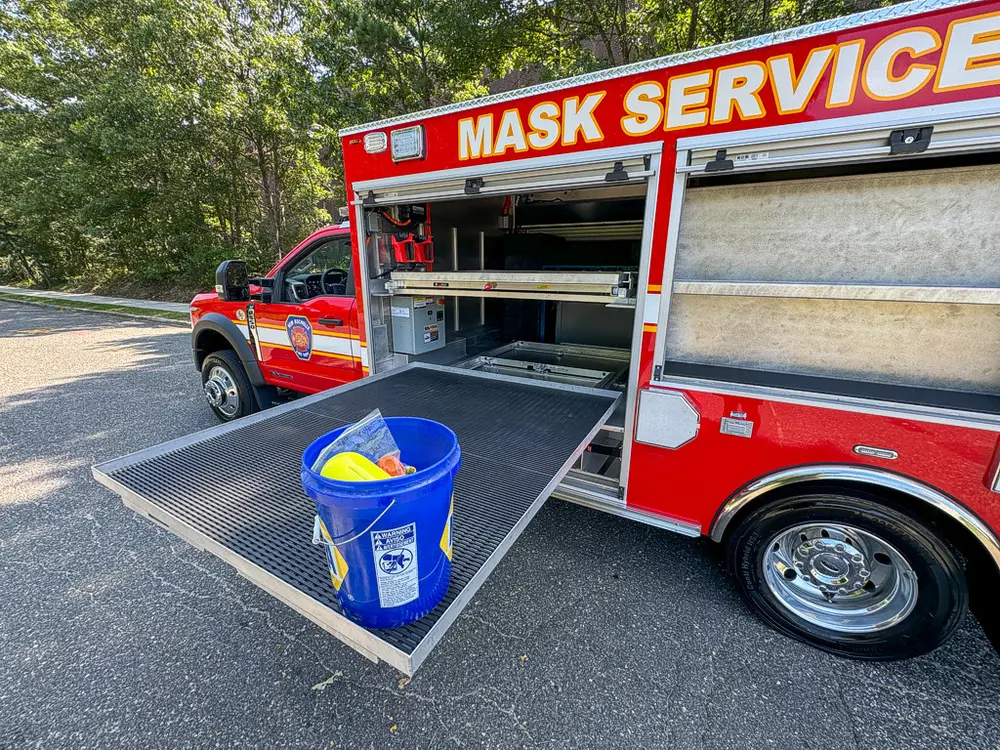 Wide right-side view with lower tray extended and compartments open.