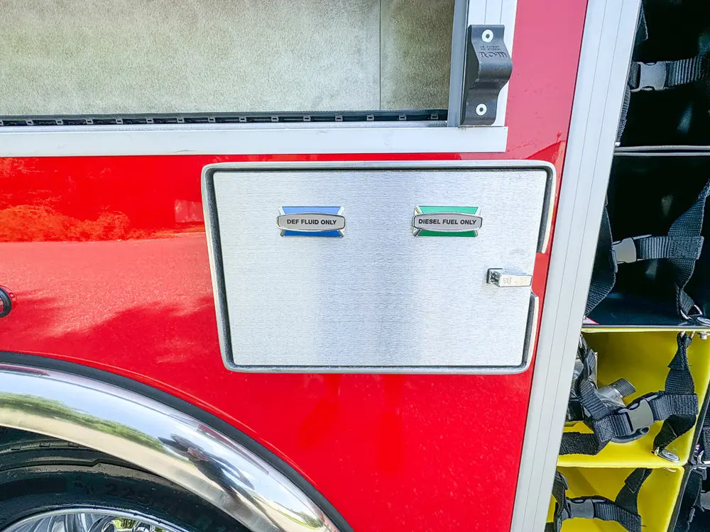 Small rectangular side access panel closed on red body.