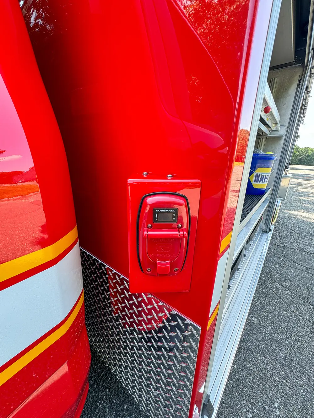 Rear side marker light and body latch close-up.