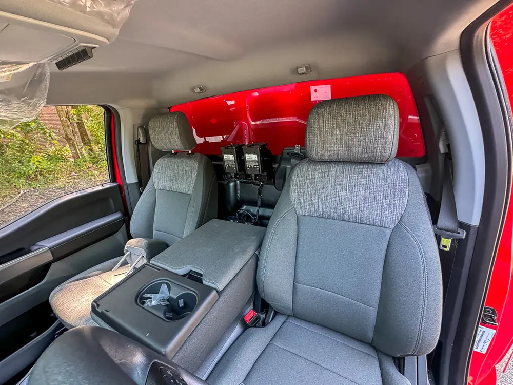 Front passenger-side interior view with seat and center console visible.