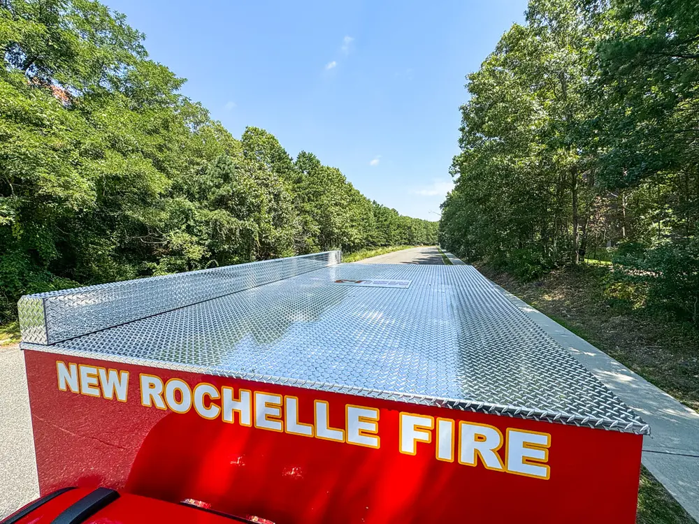 Top body panel view looking rearward over silver roof and side rails.