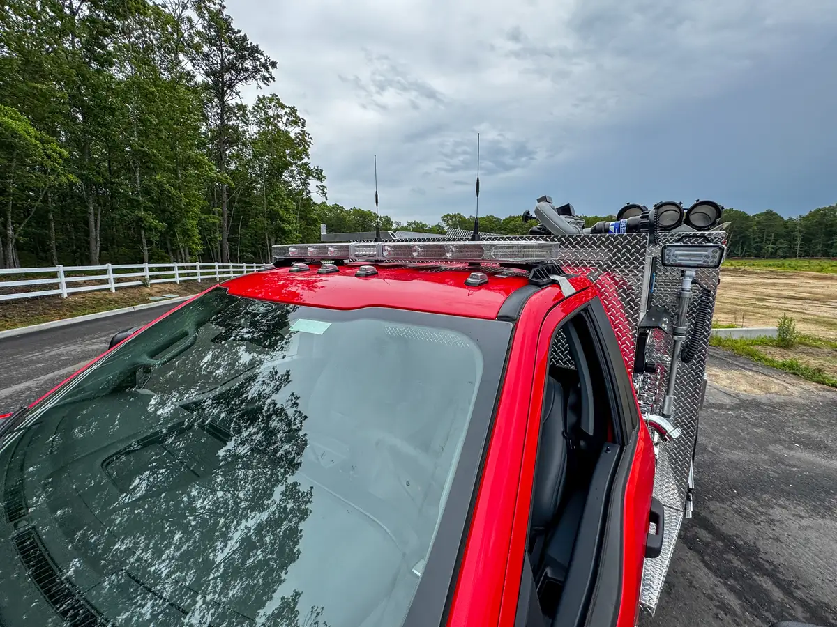 Head-on front view of red brush truck, photo 12 of 179.