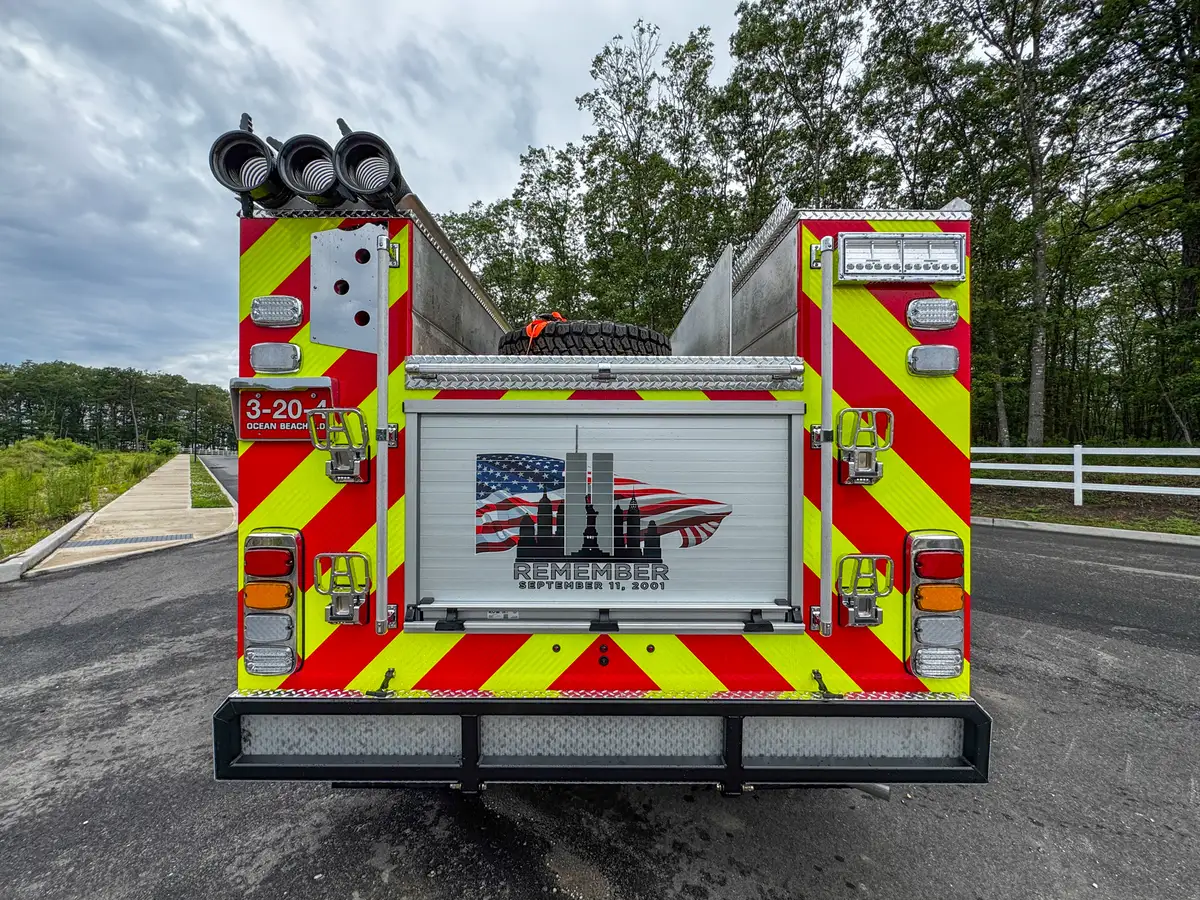 Rear-right exterior view of red brush truck, photo 24 of 179.