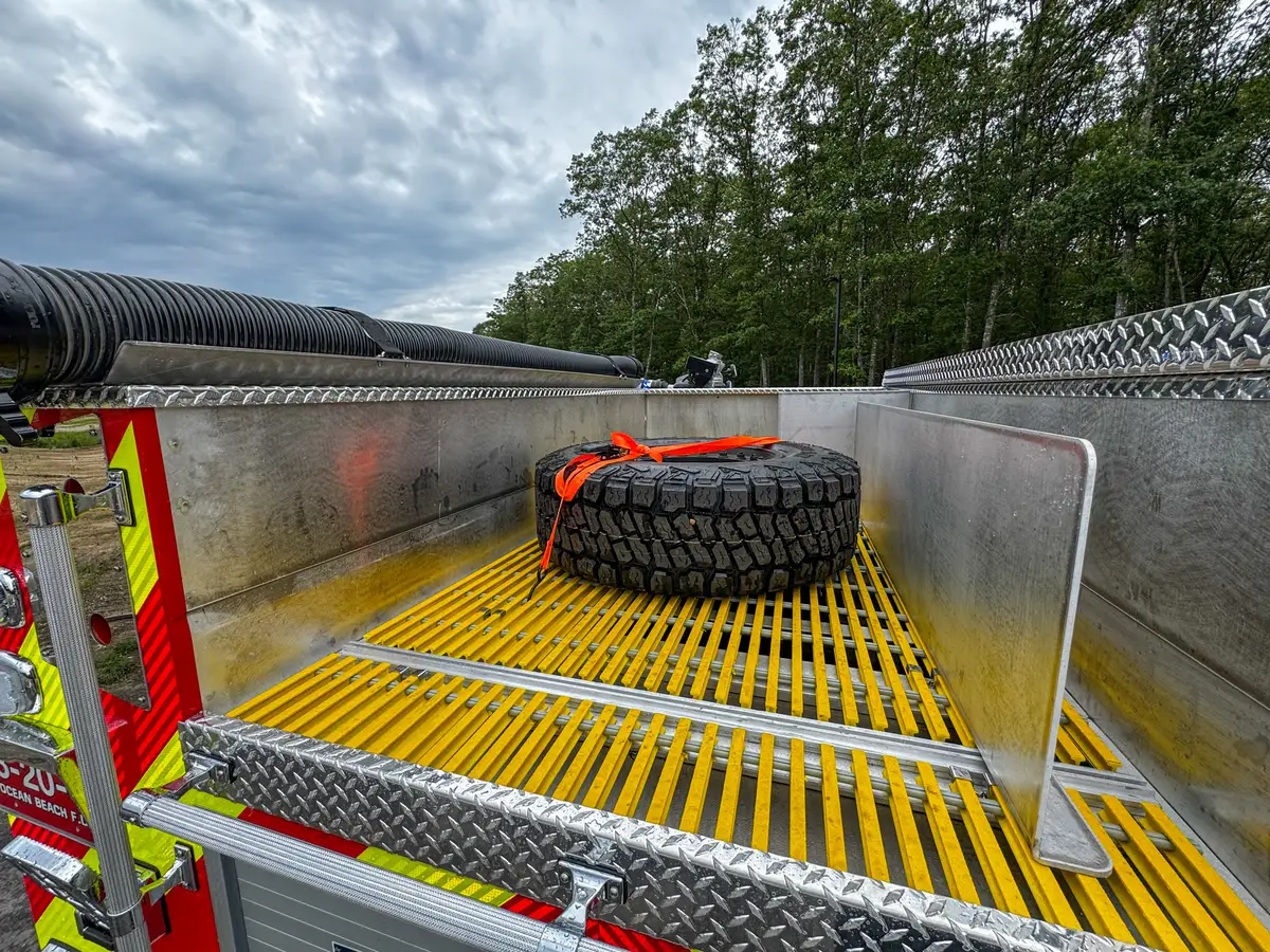 Rear-right exterior view of red brush truck, photo 34 of 179.
