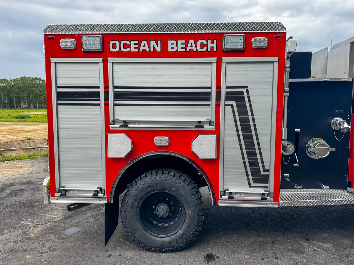 Rear-right exterior view of red brush truck, photo 44 of 179.
