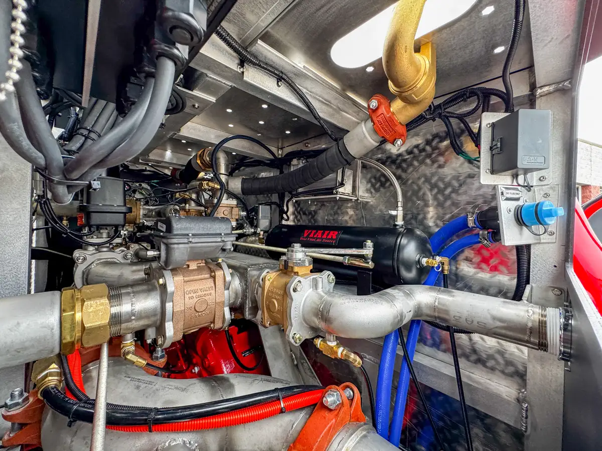 Head-on front view of red brush truck, photo 52 of 179.