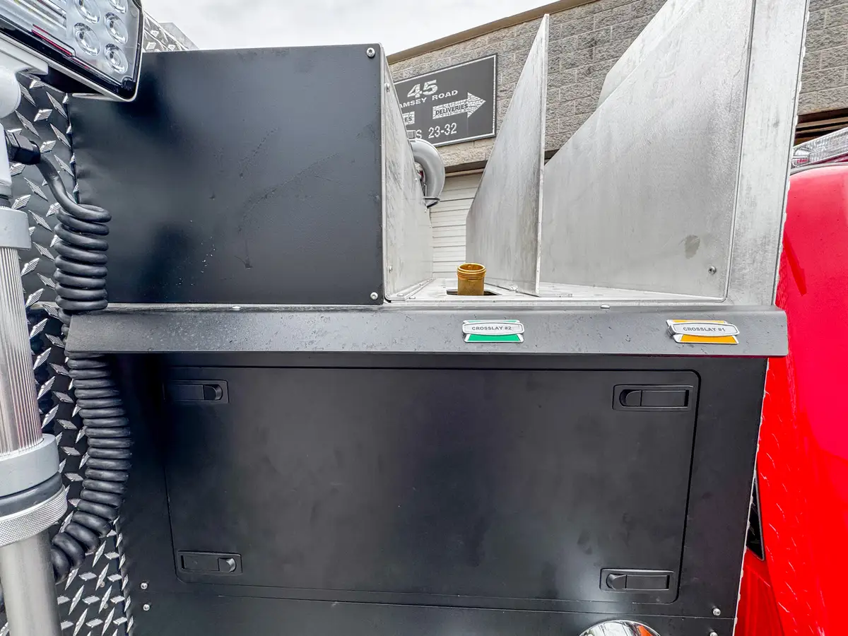 Driver-side profile of red brush truck, photo 53 of 179.