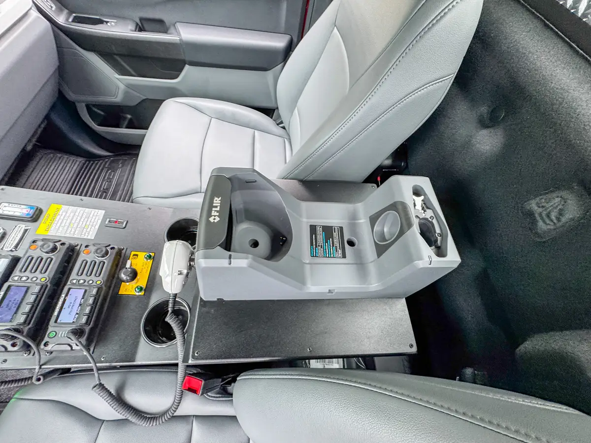 Driver-side profile of red brush truck, photo 63 of 179.