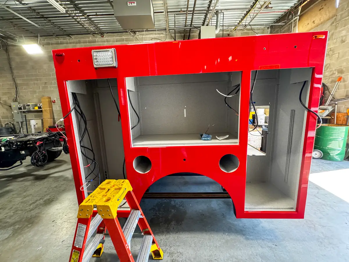 Body panels staged in production area, photo 88 of 179.