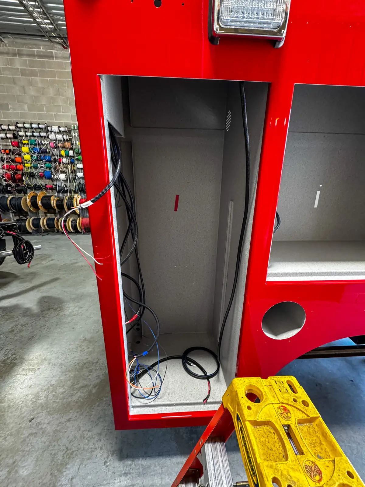 Open compartment with unfinished interior surfaces, photo 89 of 179.