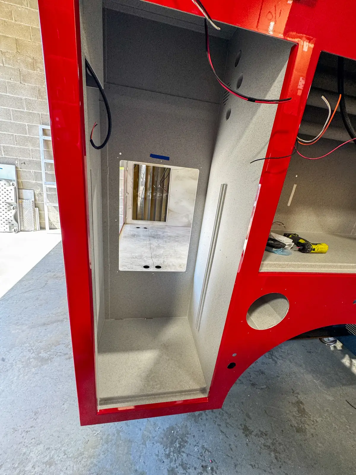 Side view of cab and body in assembly bay, photo 96 of 179.