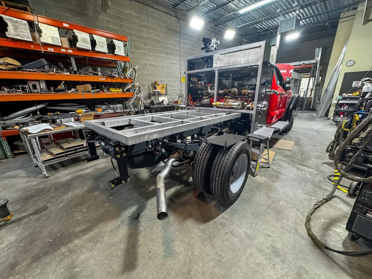 Unpainted aluminum compartment structure in shop, photo 122 of 179.