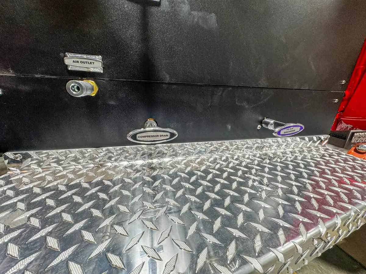 Side view of cab and body in assembly bay, photo 126 of 179.