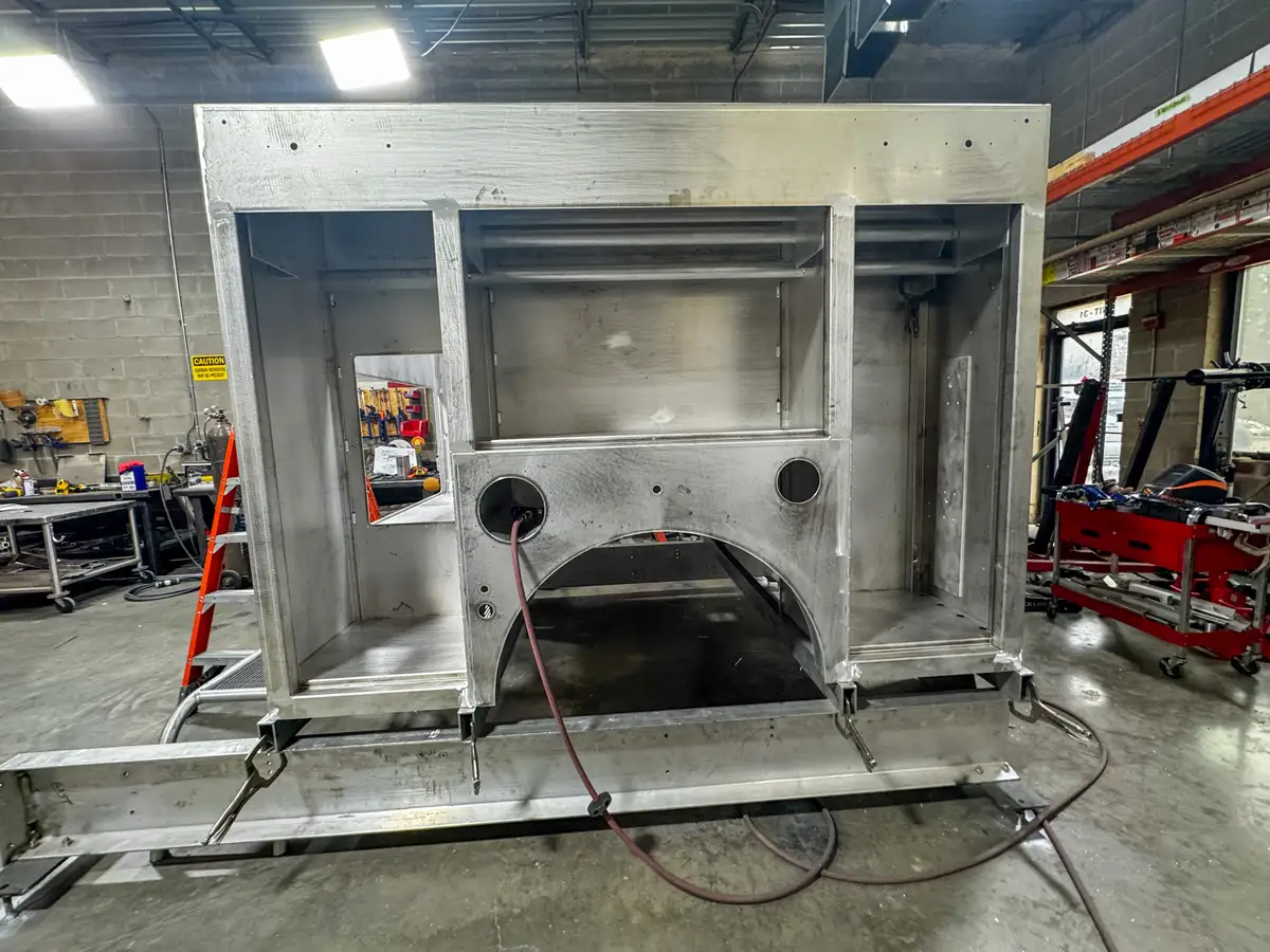 Brush truck body module in fabrication shop, photo 131 of 179.