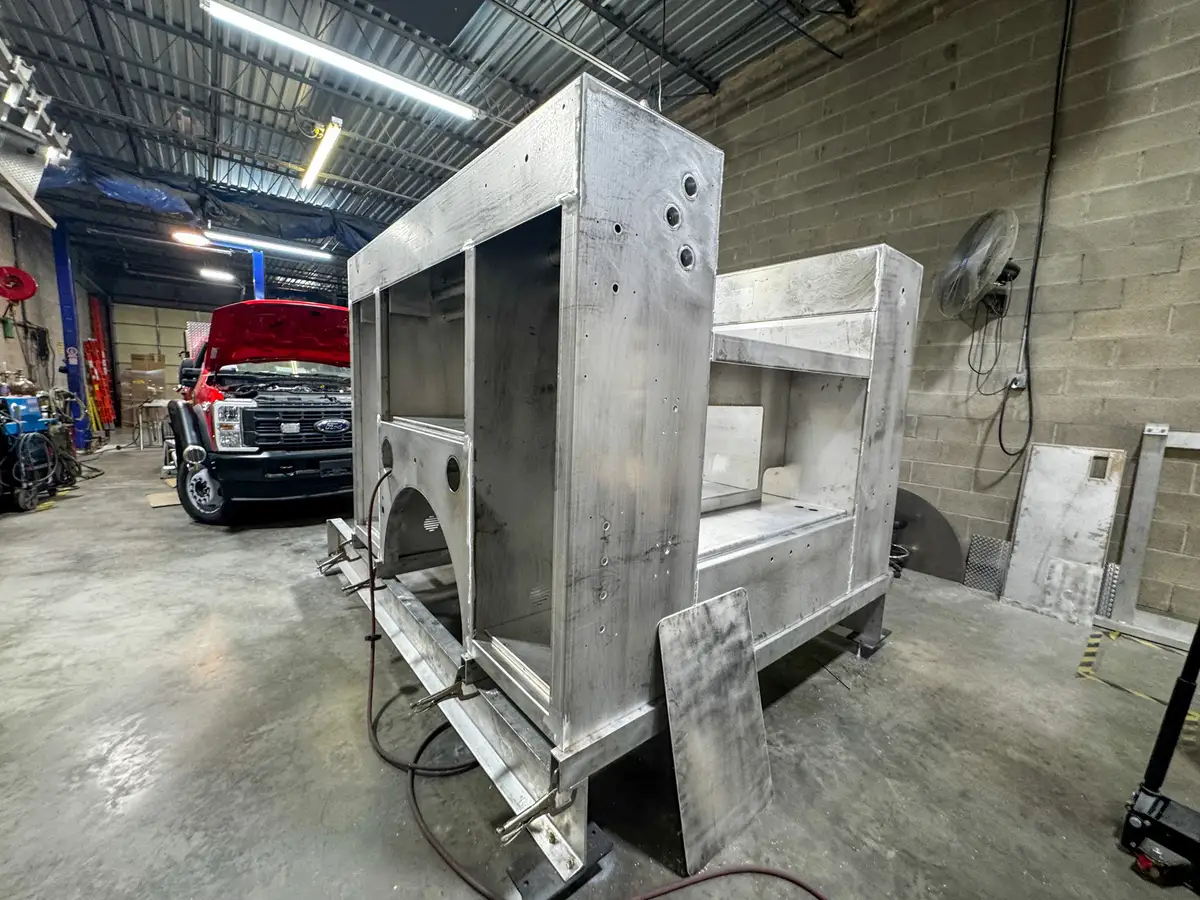 Unpainted aluminum compartment structure in shop, photo 132 of 179.