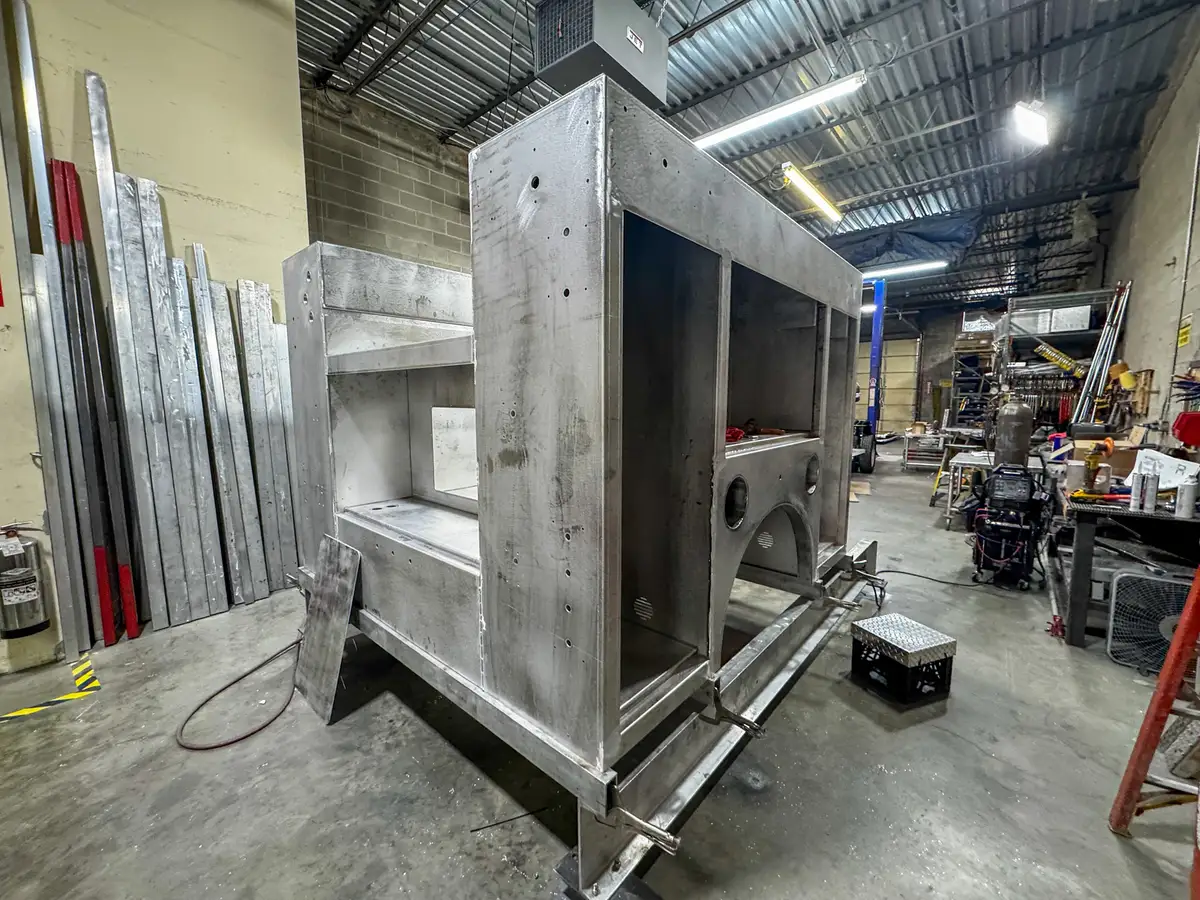 Cab interior during upfit with exposed wiring, photo 135 of 179.
