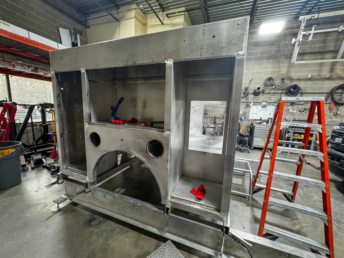 Compartment framing and shelves during fabrication, photo 137 of 179.
