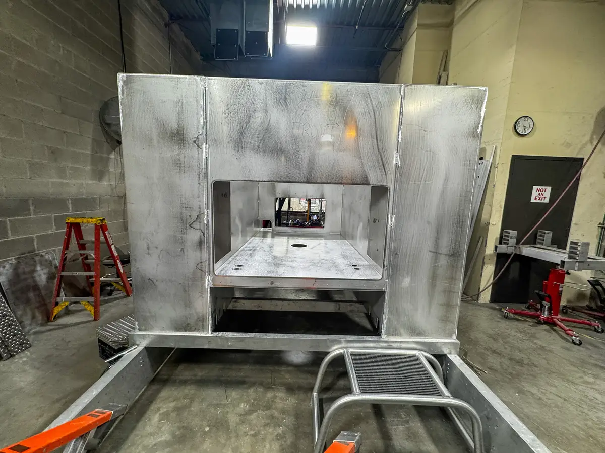 Open compartment with unfinished interior surfaces, photo 139 of 179.