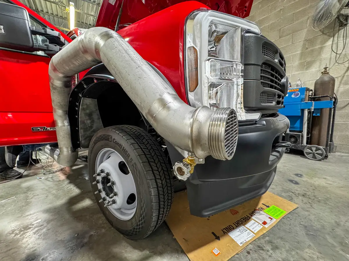 Cab interior during upfit with exposed wiring, photo 145 of 179.