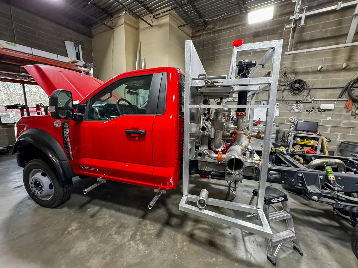 Cab interior during upfit with exposed wiring, photo 165 of 179.