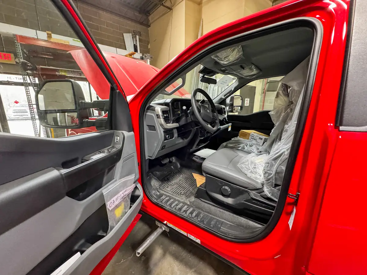 Side view of cab and body in assembly bay, photo 166 of 179.