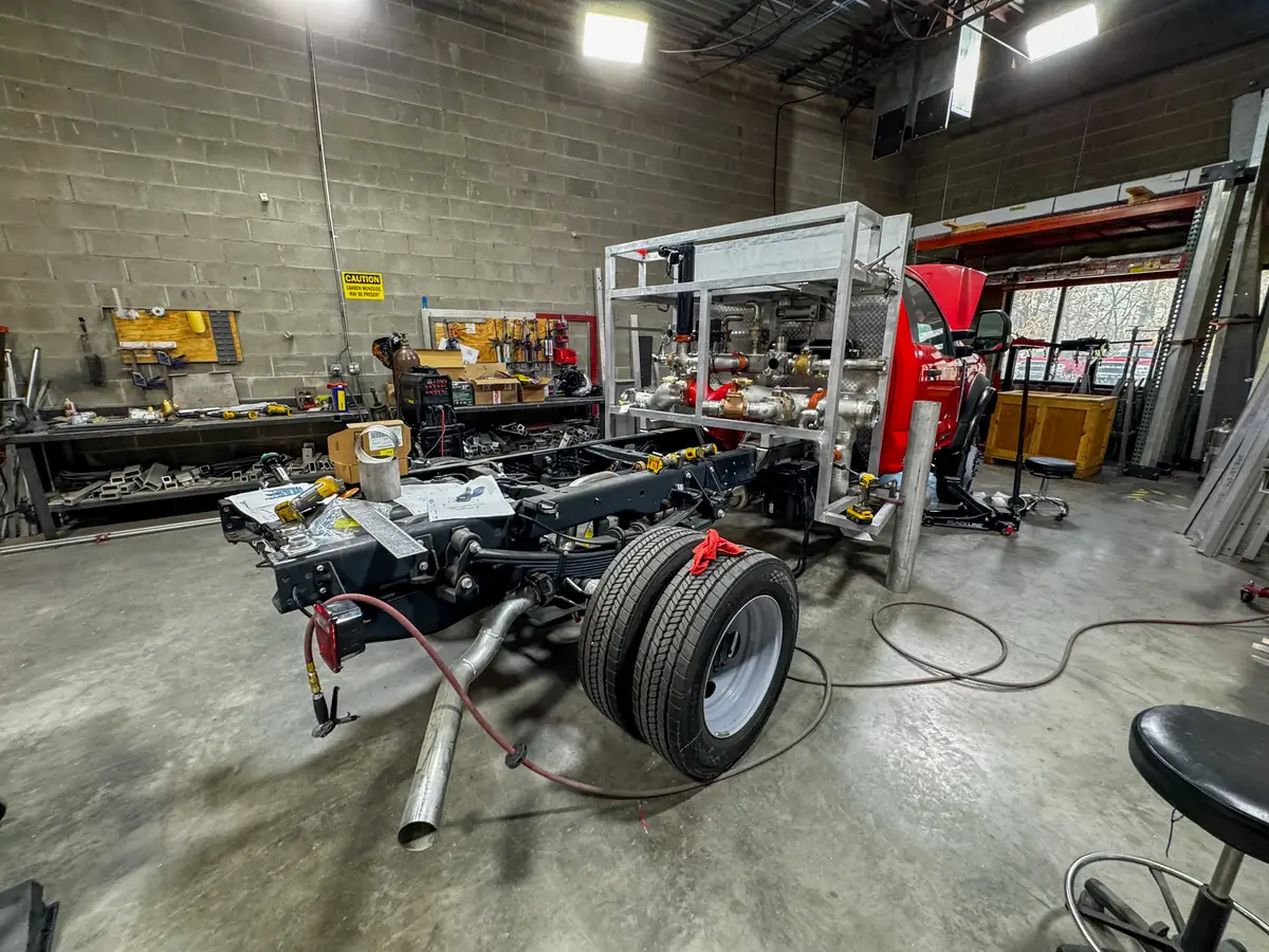 Cab interior during upfit with exposed wiring, photo 175 of 179.